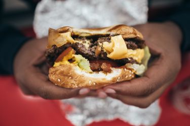 Person eating a burger