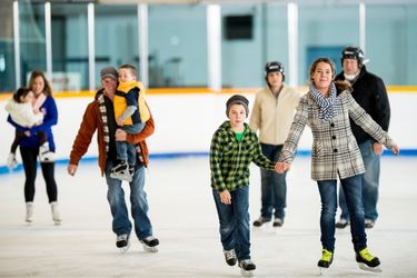 People ice skating in an ice arena