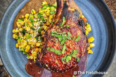 Double bone in pork chop - Black bean Achiote purée - Esquites - Sauce made with red wine, lime juice, beef stock, achiote, brown sugar, and Maui Wowee from the spiceology fam.